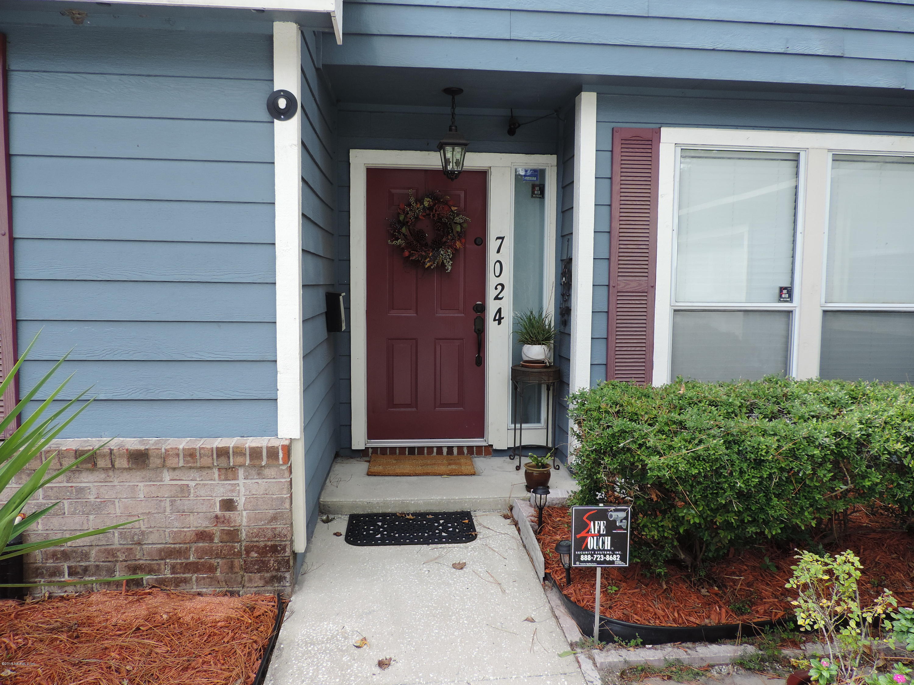 7024 St Augustine Road Jacksonville, FL 32217 - Photo 2 of 34 a front view of a house with a yard