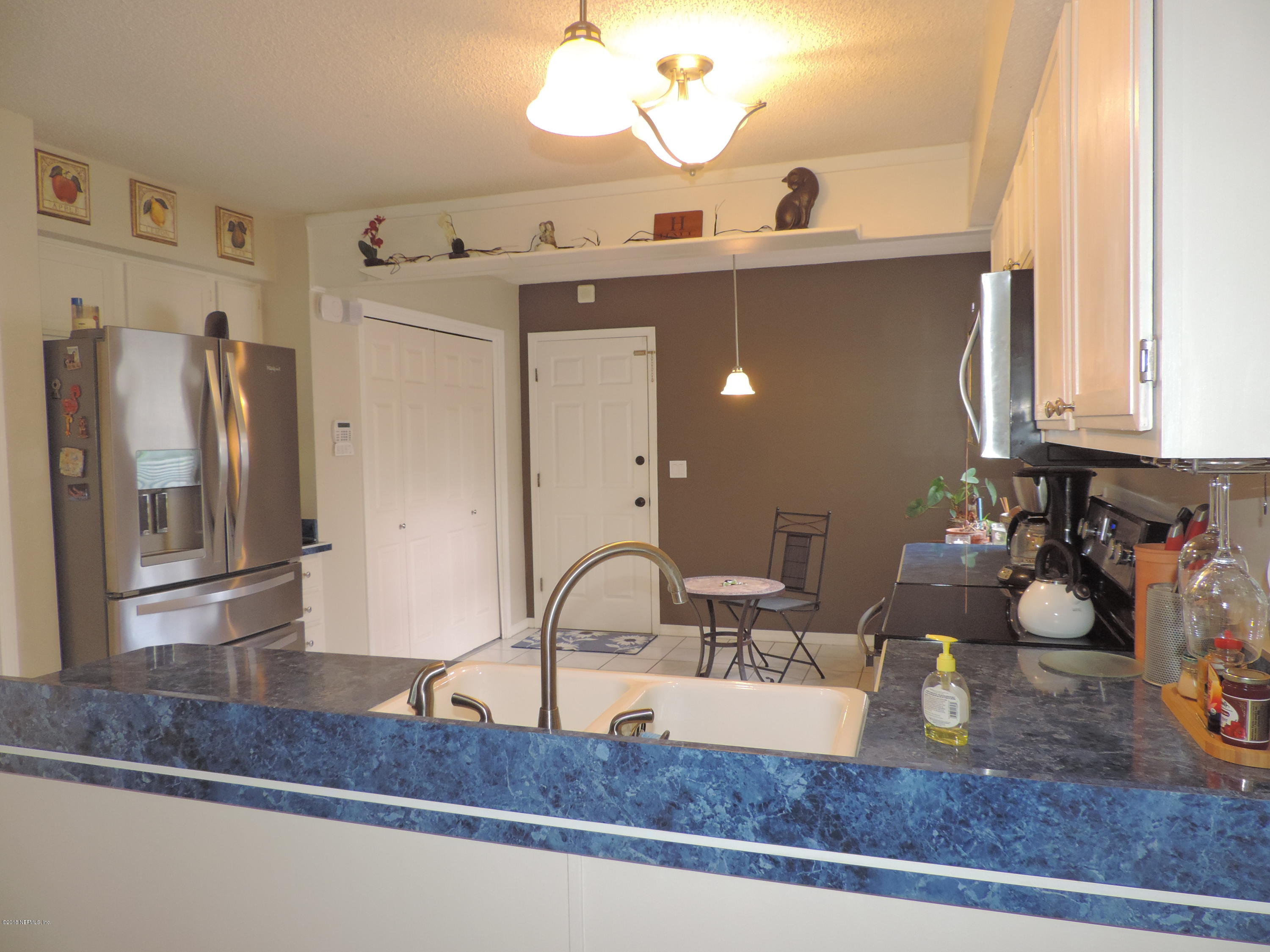 7024 St Augustine Road Jacksonville, FL 32217 - Photo 21 of 34 a bathroom with a sink and a mirror