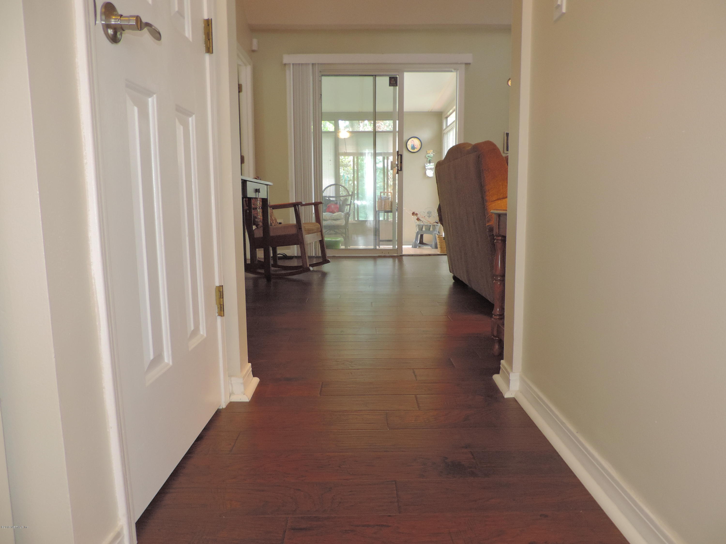 7024 St Augustine Road Jacksonville, FL 32217 - Photo 3 of 34 a view of a livingroom with furniture and front door