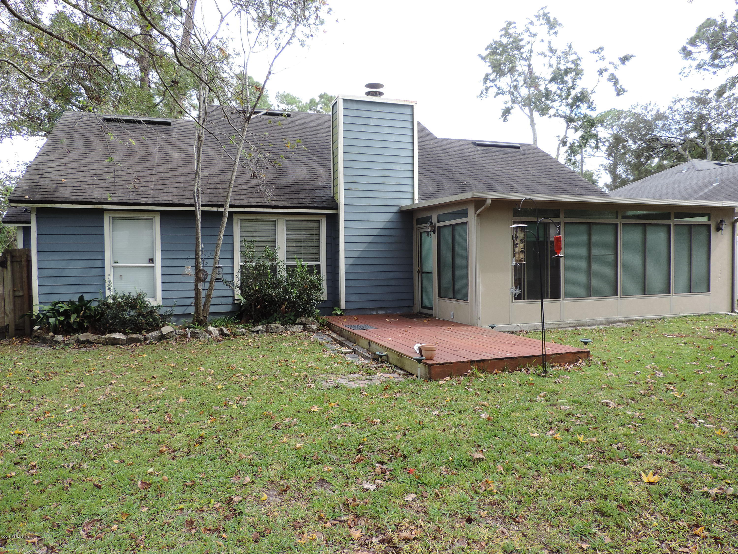 7024 St Augustine Road Jacksonville, FL 32217 - Photo 32 of 34 a front view of a house with a yard and garage