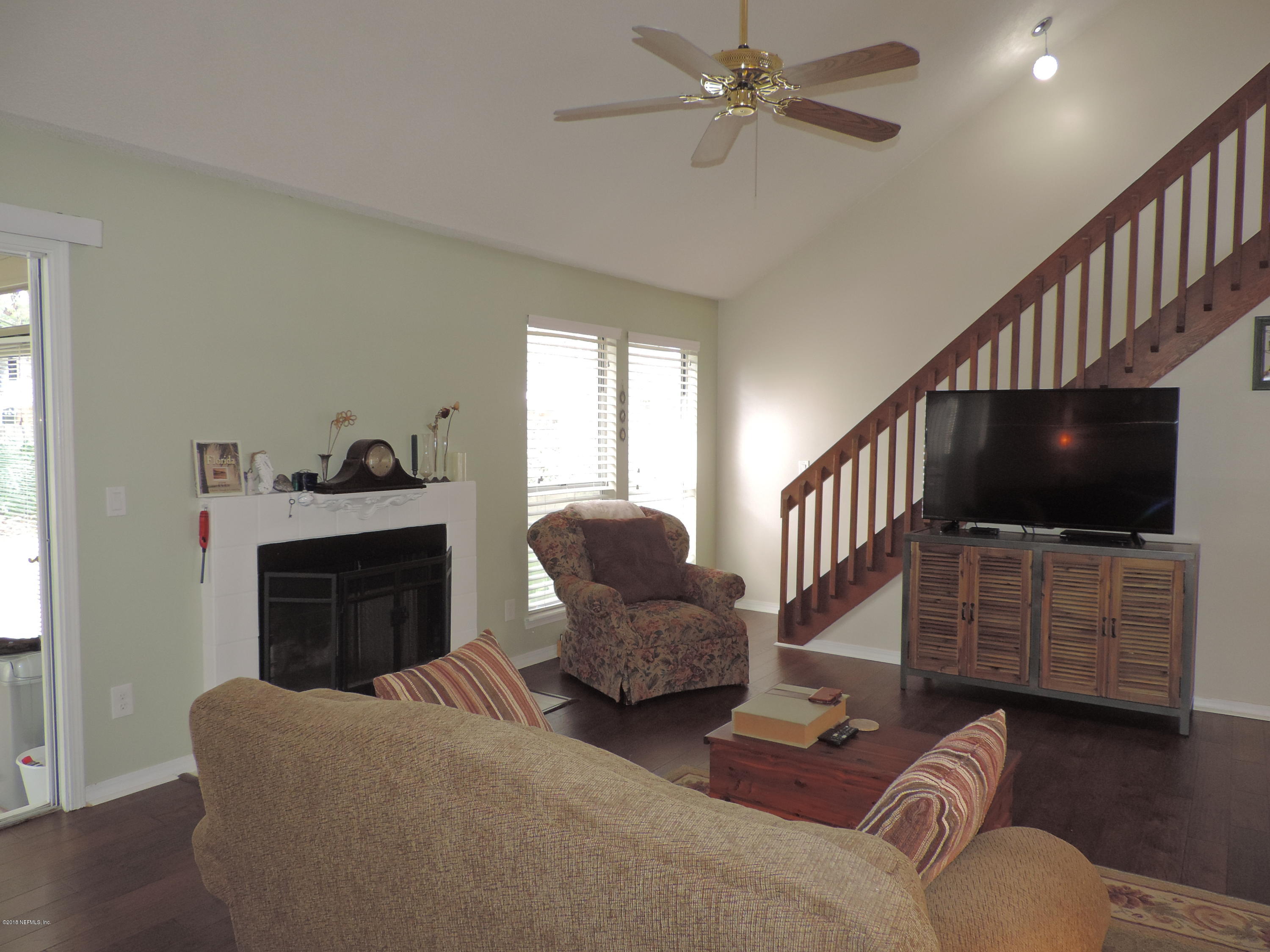 7024 St Augustine Road Jacksonville, FL 32217 - Photo 7 of 34 a living room with furniture and a flat screen tv