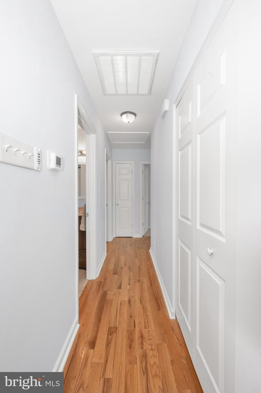 1107 2nd Avenue Brunswick, MD 21716 - Photo 16 of 52 a view of a hallway with wooden floor