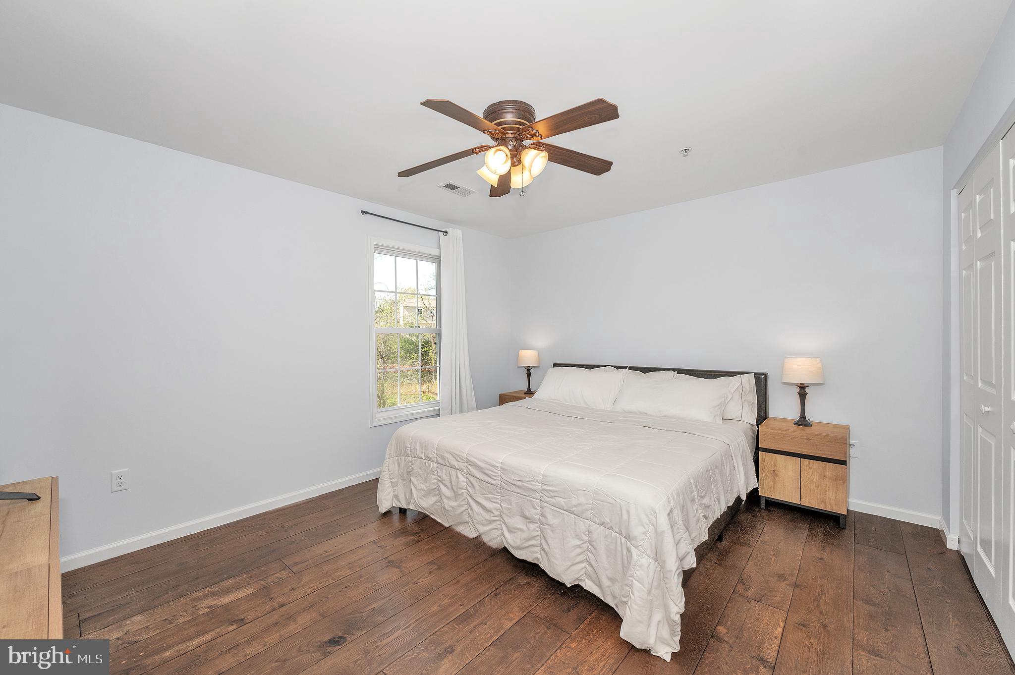 1107 2nd Avenue Brunswick, MD 21716 - Photo 18 of 52 a bedroom with a bed and window