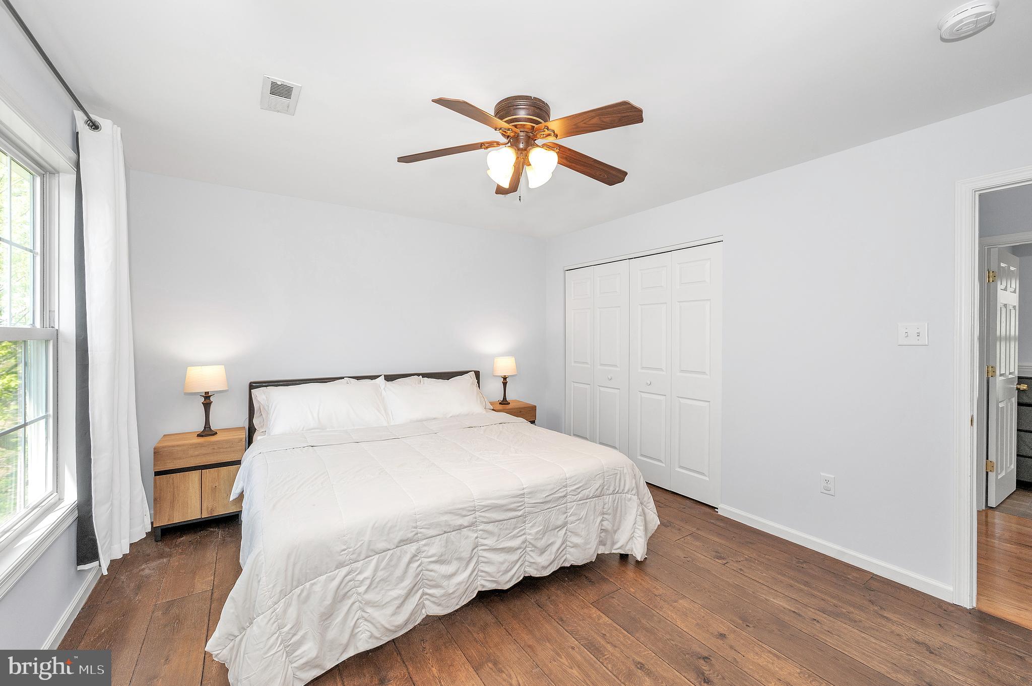 1107 2nd Avenue Brunswick, MD 21716 - Photo 19 of 52 a bedroom with a bed and window