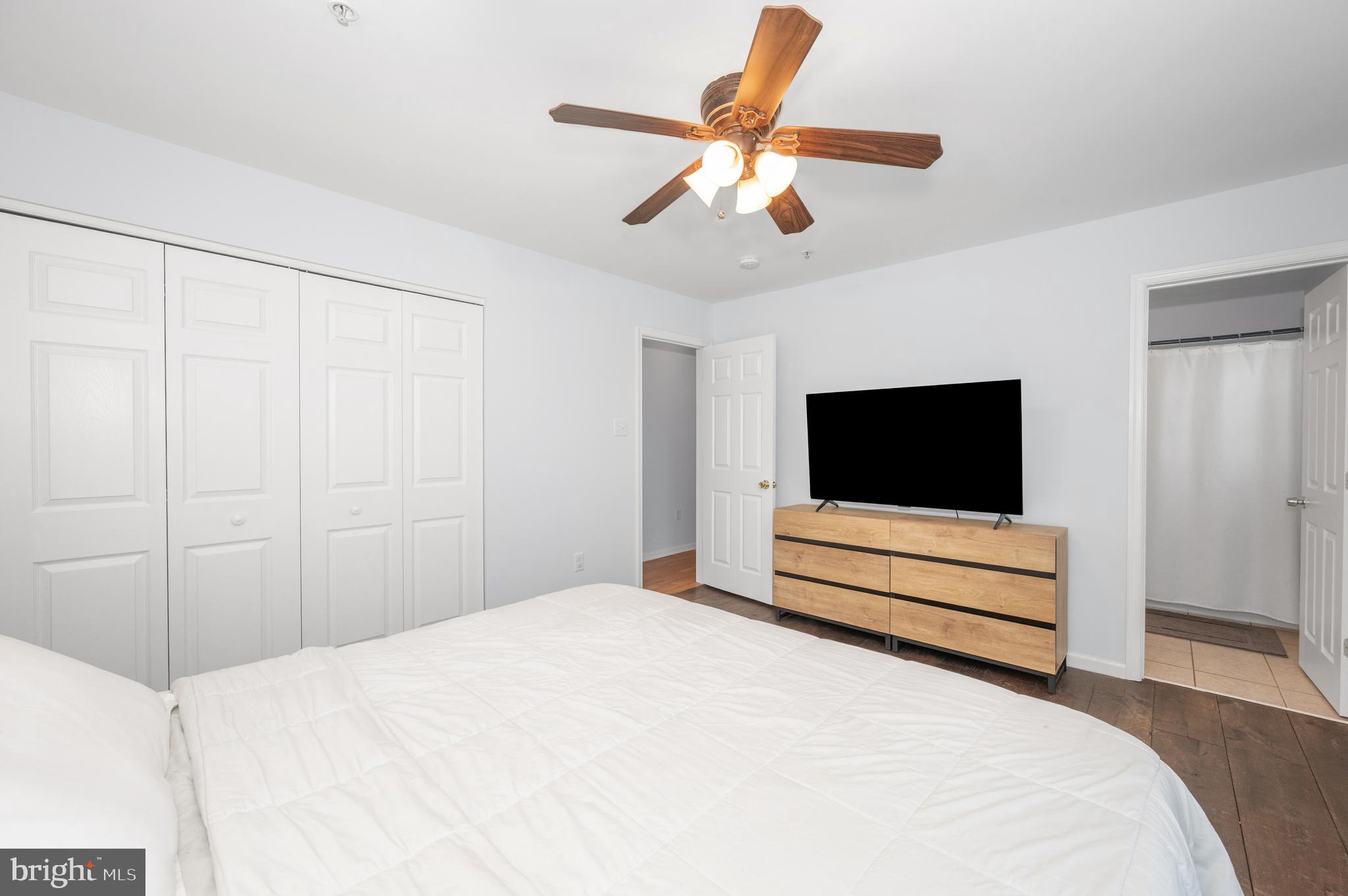 1107 2nd Avenue Brunswick, MD 21716 - Photo 20 of 52 a bedroom with a bed and a flat screen tv