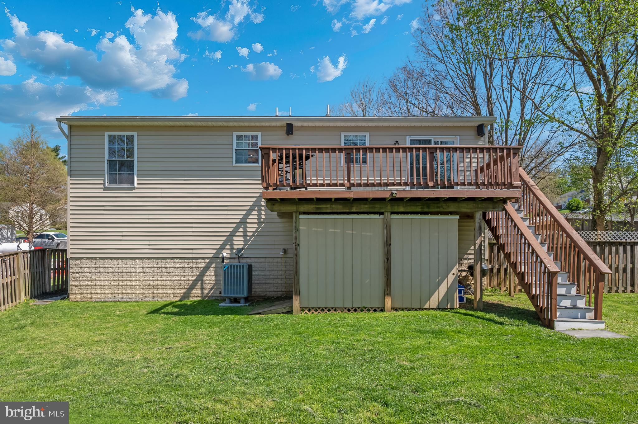 1107 2nd Avenue Brunswick, MD 21716 - Photo 37 of 52 a view of backyard with barbeque grill and stairs