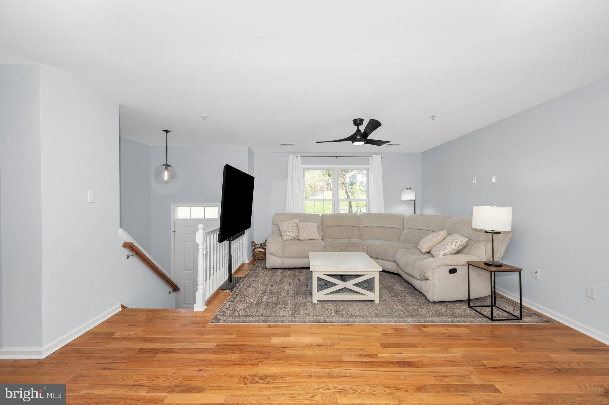 1107 2nd Avenue Brunswick, MD 21716 - Photo 4 of 52 a living room with furniture and a flat screen tv
