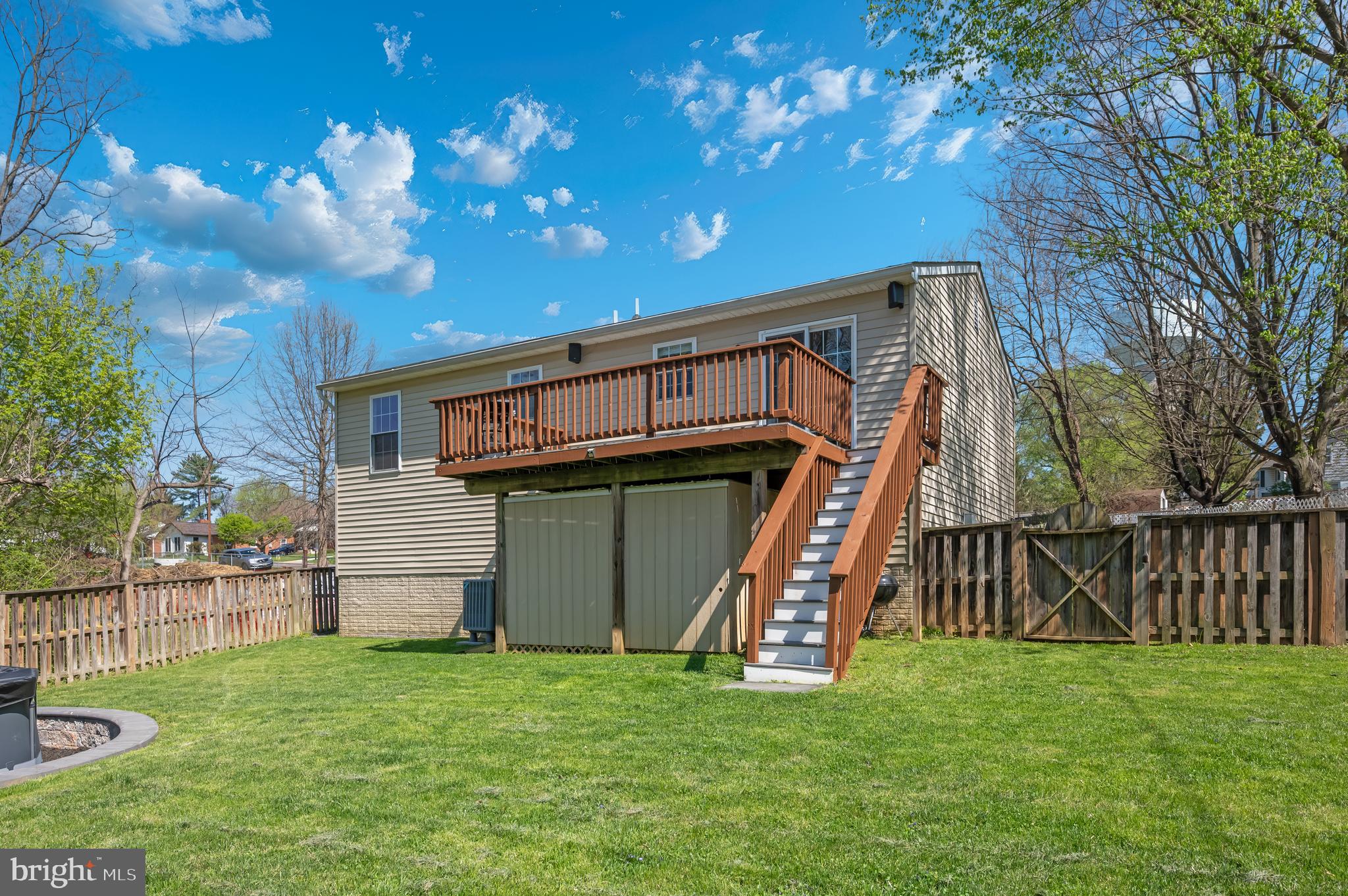 1107 2nd Avenue Brunswick, MD 21716 - Photo 41 of 52 a view of a backyard with a garden and deck