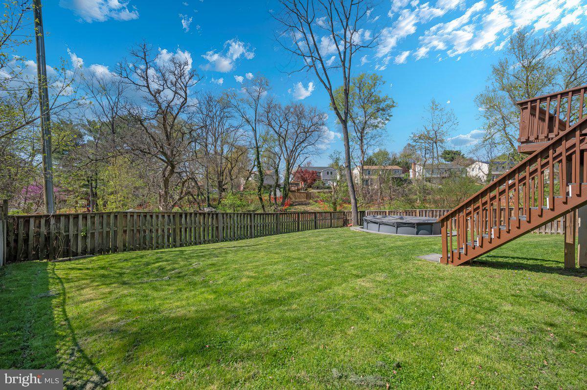 1107 2nd Avenue Brunswick, MD 21716 - Photo 44 of 52 a view of a deck with a big yard and large trees