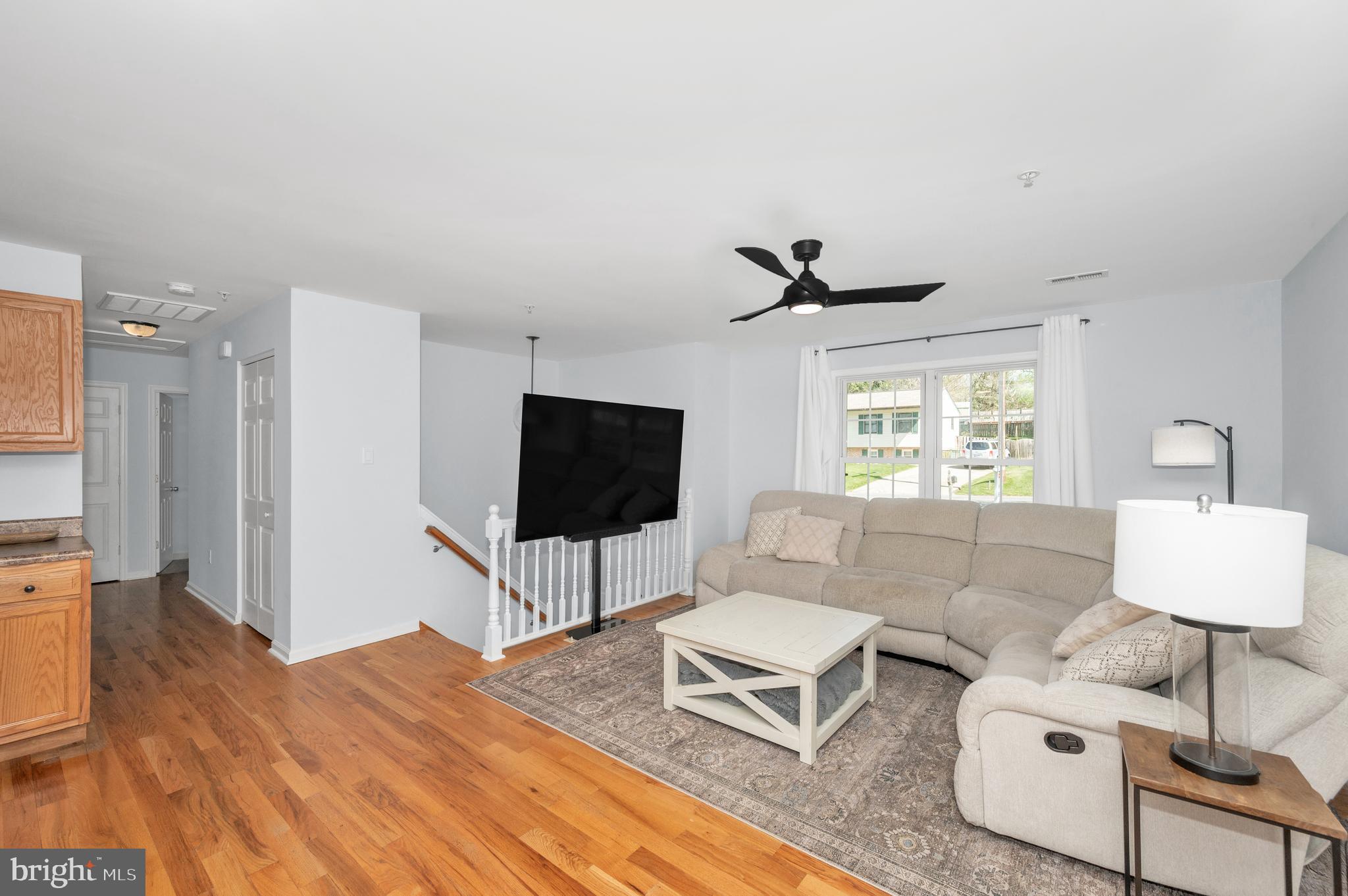 1107 2nd Avenue Brunswick, MD 21716 - Photo 5 of 52 a living room with furniture and a flat screen tv