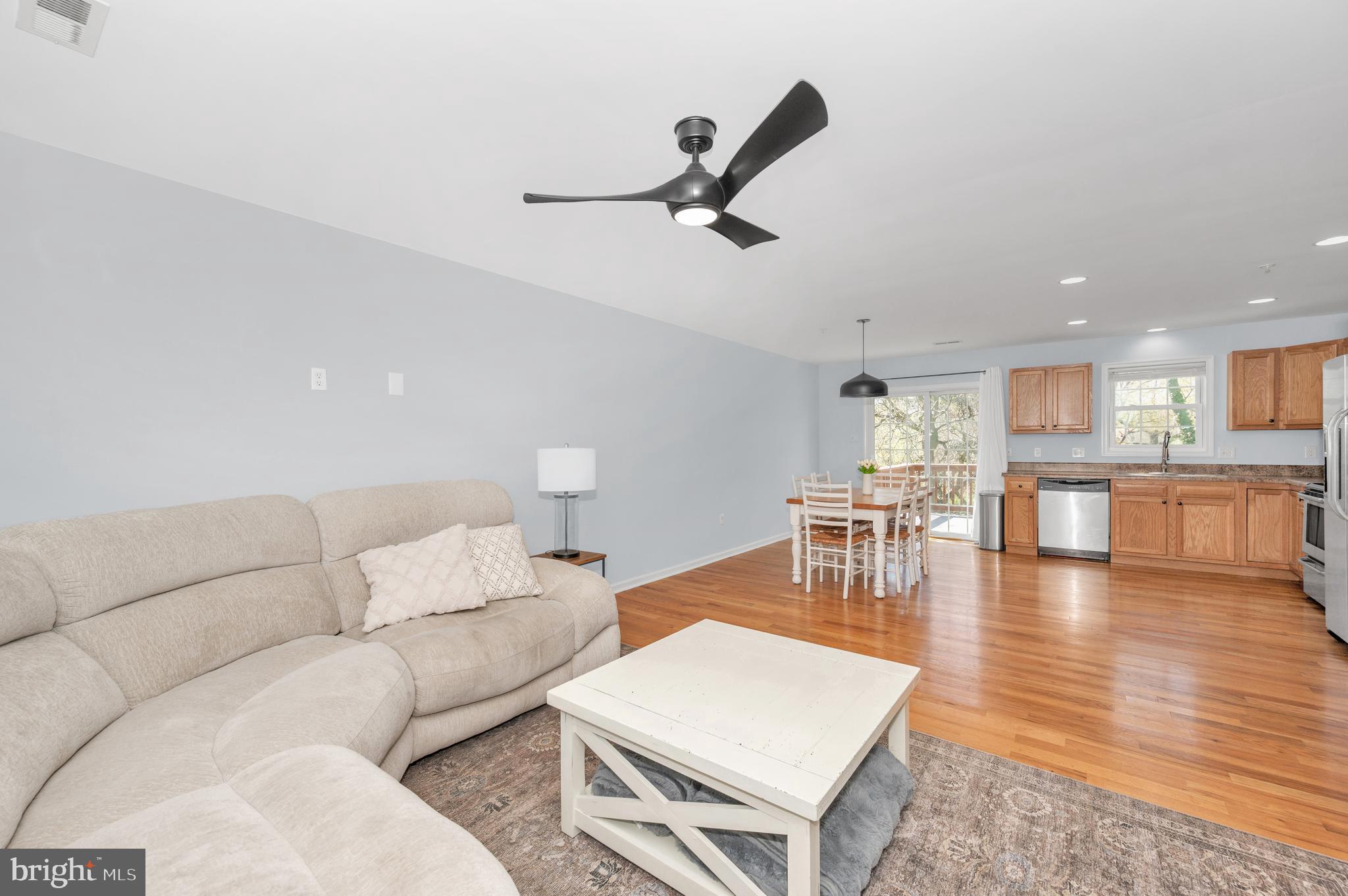 1107 2nd Avenue Brunswick, MD 21716 - Photo 6 of 52 a living room with furniture and a view of kitchen