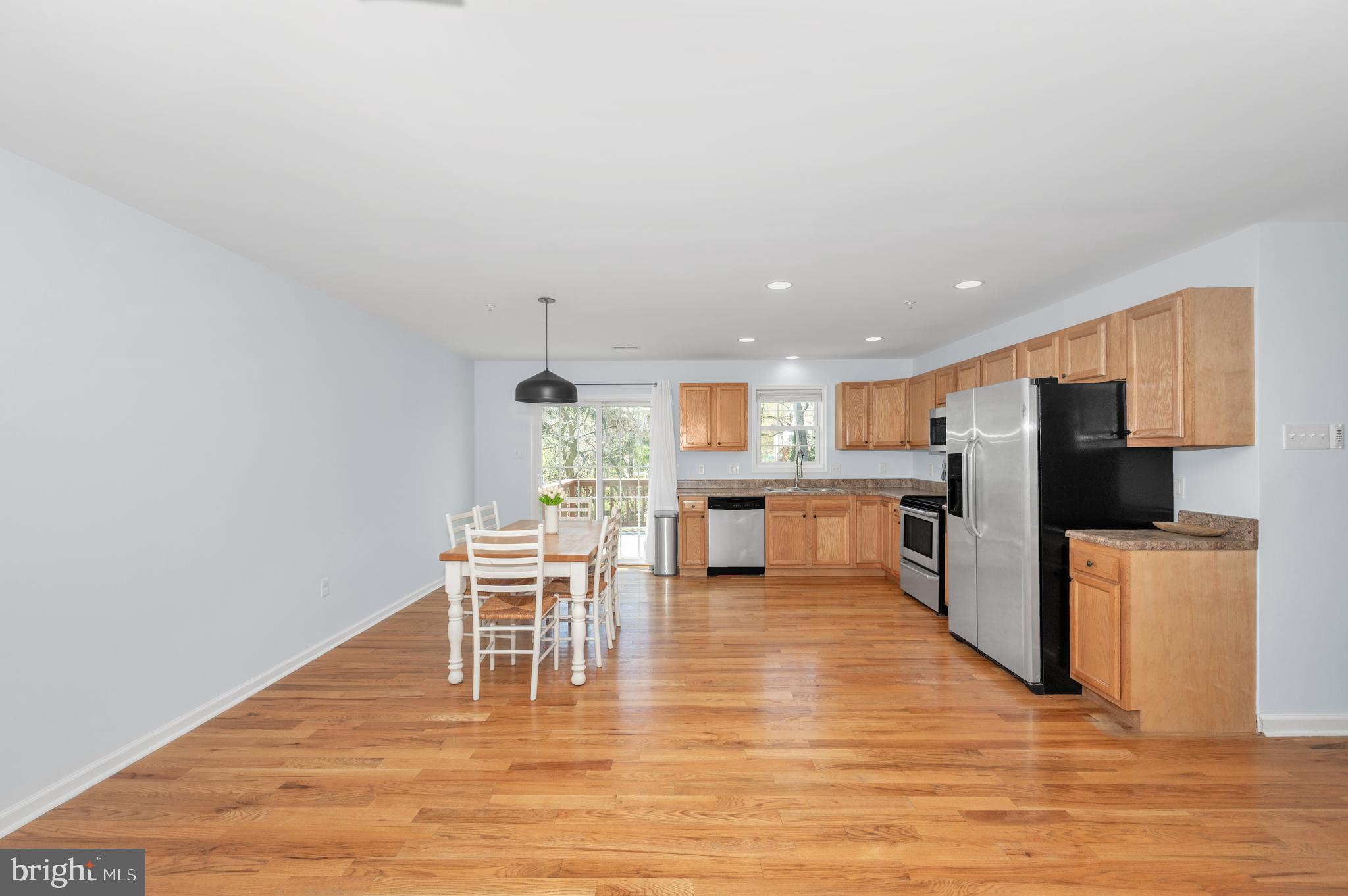 1107 2nd Avenue Brunswick, MD 21716 - Photo 7 of 52 a view of a kitchen with dining table and chairs