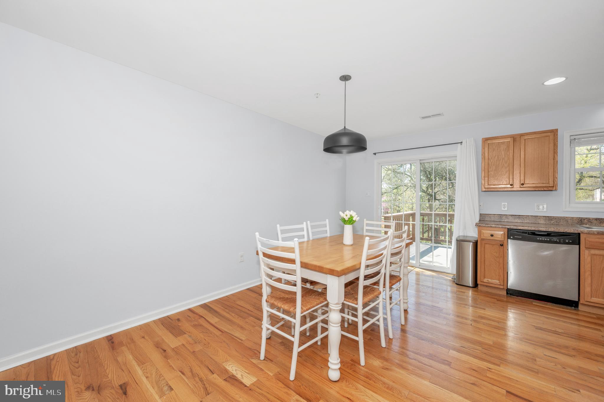 1107 2nd Avenue Brunswick, MD 21716 - Photo 8 of 52 a view of a dining room with furniture window and wooden floor