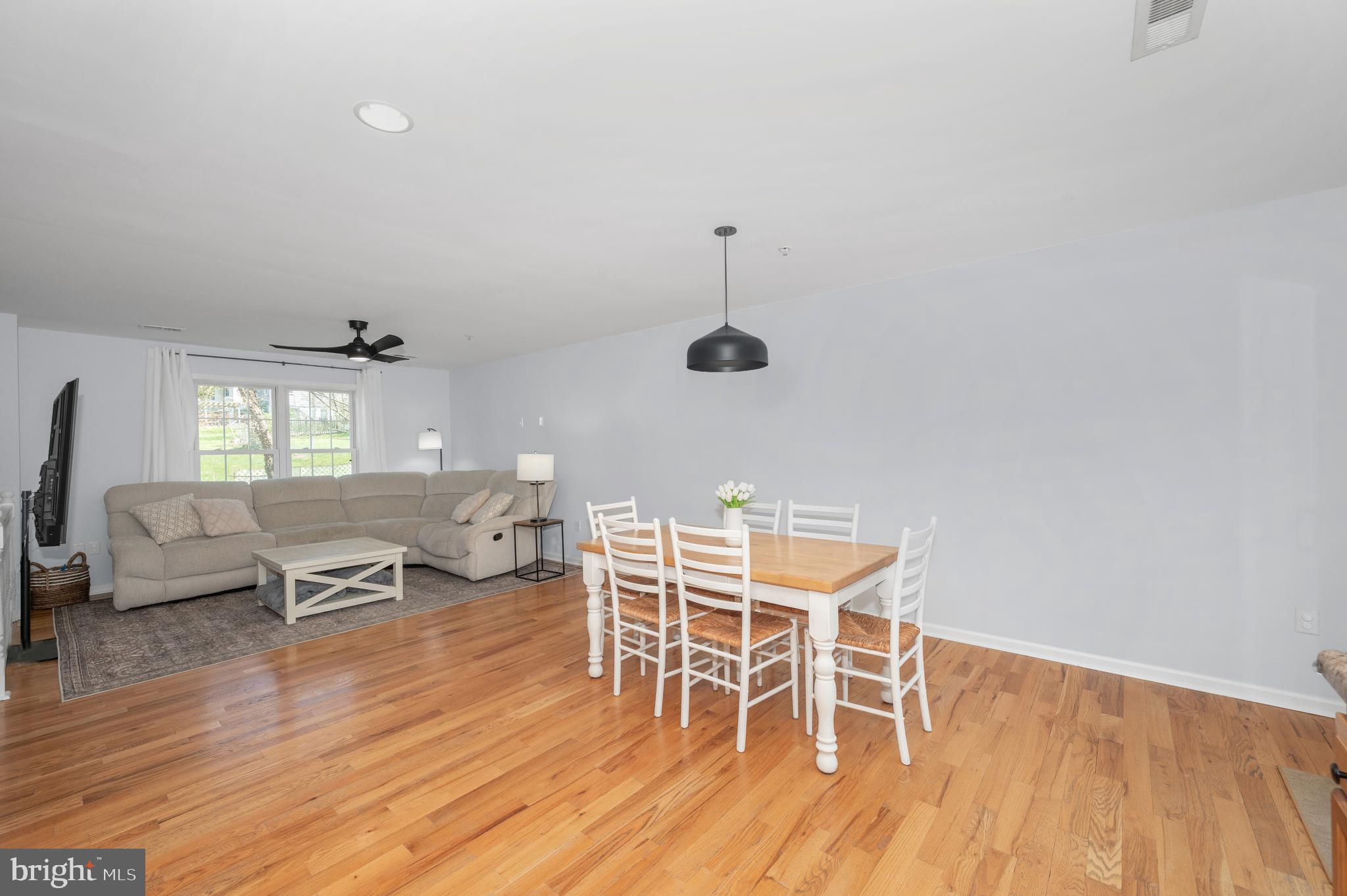 1107 2nd Avenue Brunswick, MD 21716 - Photo 9 of 52 a dining room with furniture and wooden floor