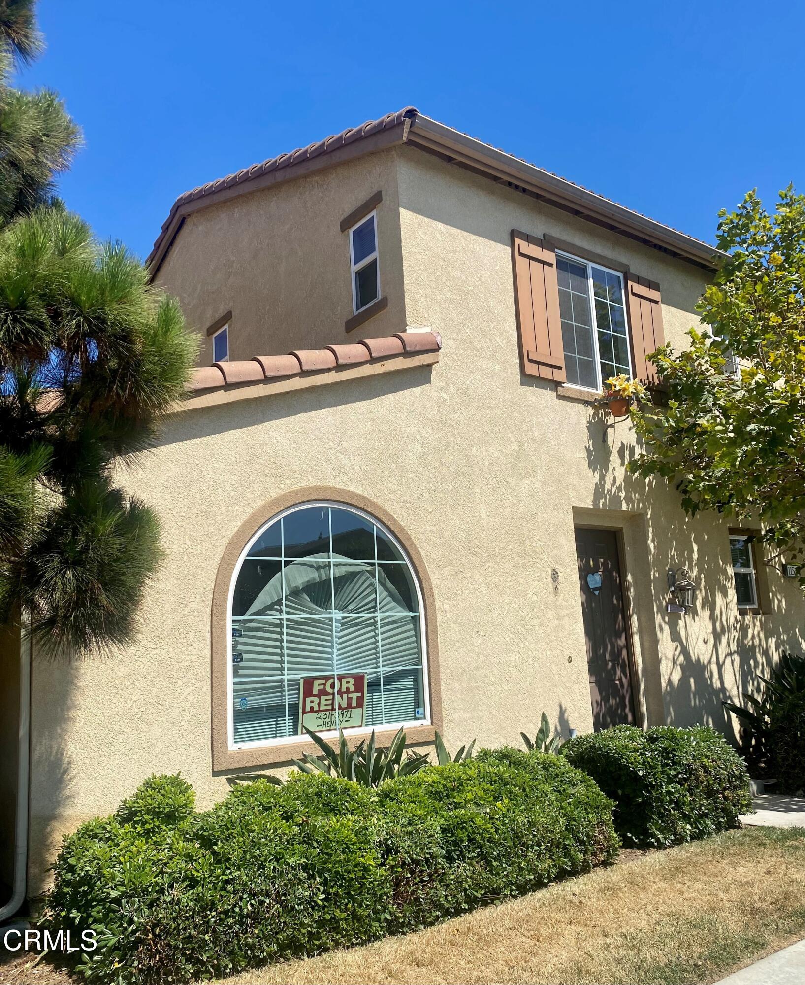1154 North A Street Oxnard, CA 93030 - Photo 1 of 3 a front view of a house with garden