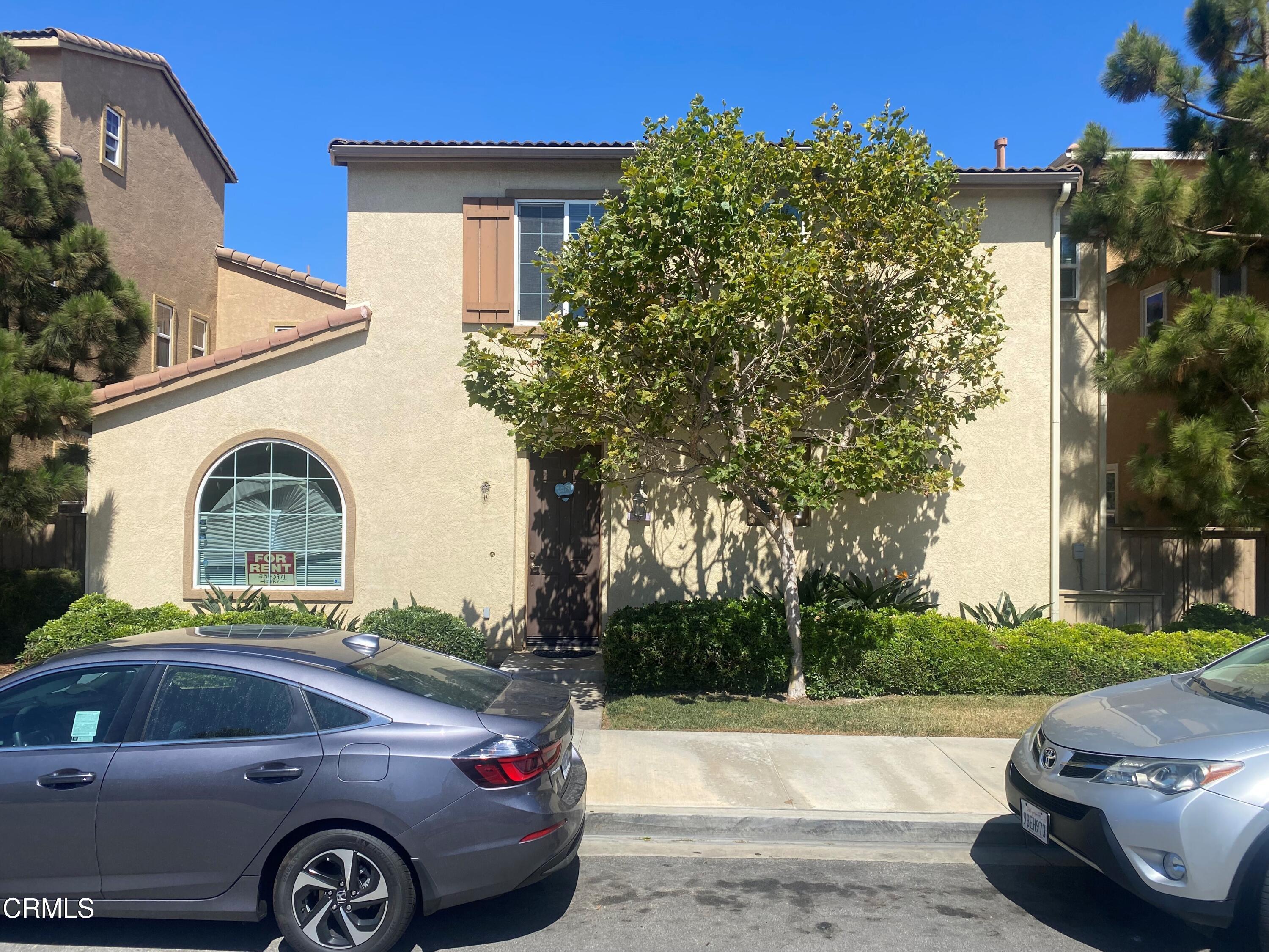 1154 North A Street Oxnard, CA 93030 - Photo 2 of 3 a front view of a house with parking space