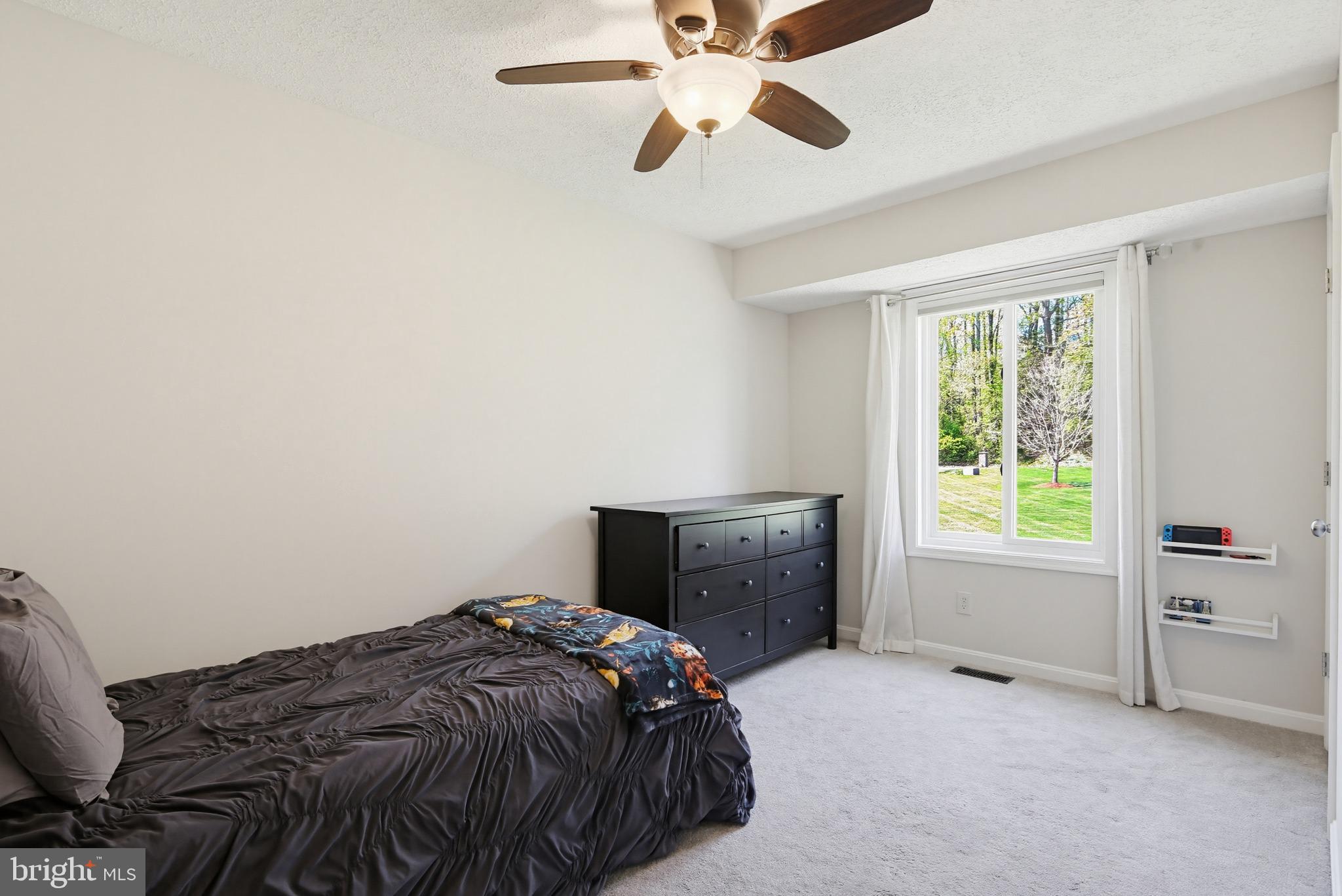3229 Beards Point Road Davidsonville, MD 21035 - Photo 37 of 69 a bedroom with a bed and a window