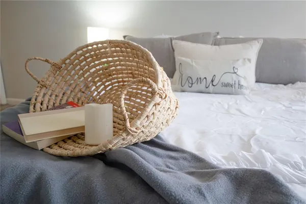 a view of a bedroom with furniture