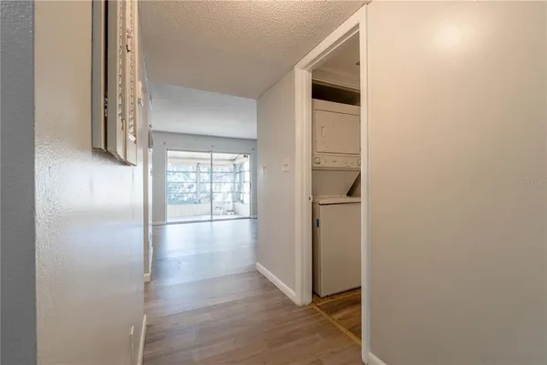 a view of hallway with wooden floor