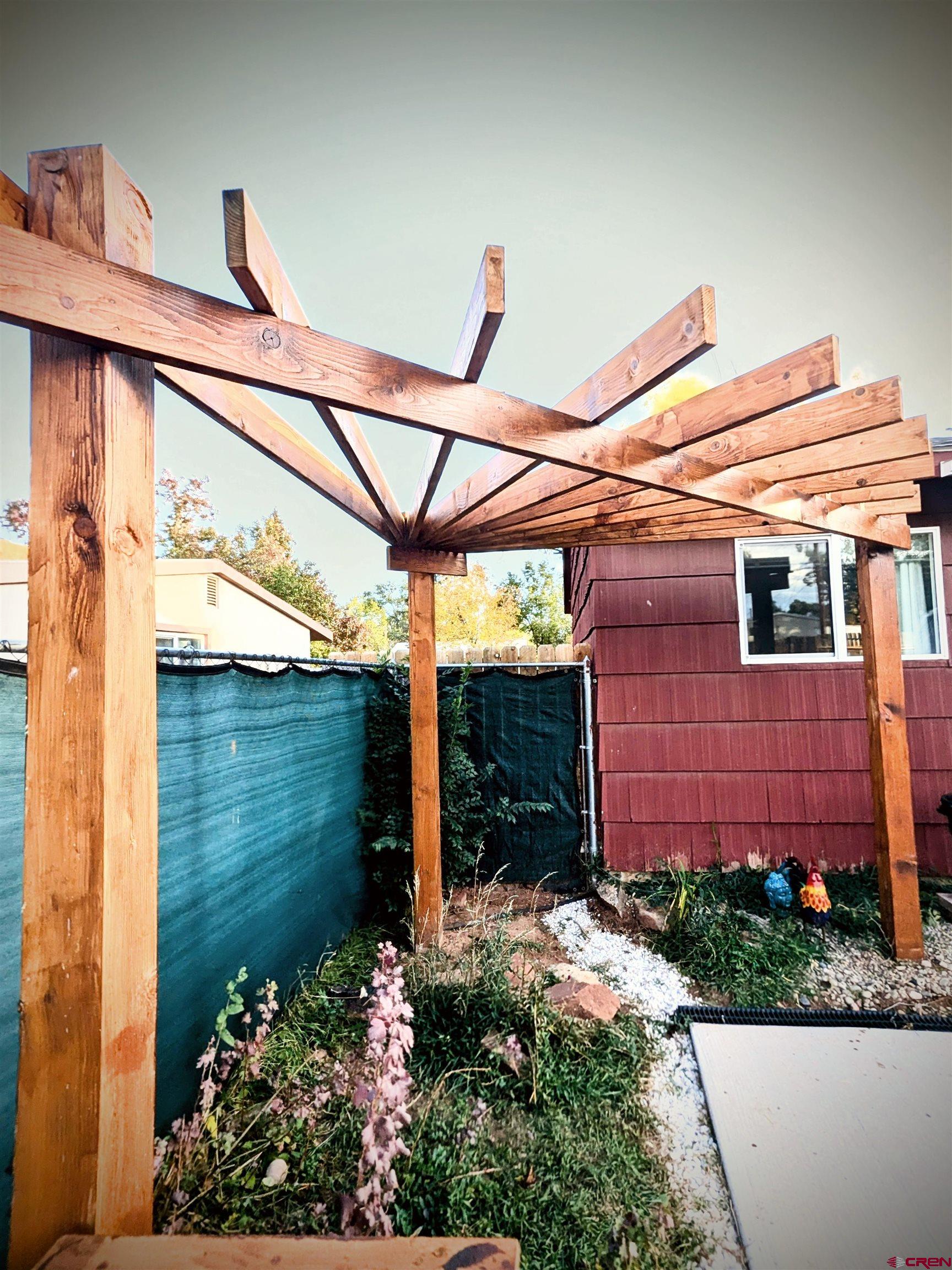 714 East 3rd Street Cortez, CO 81321 - Photo 13 of 14 a view of a backyard with plants