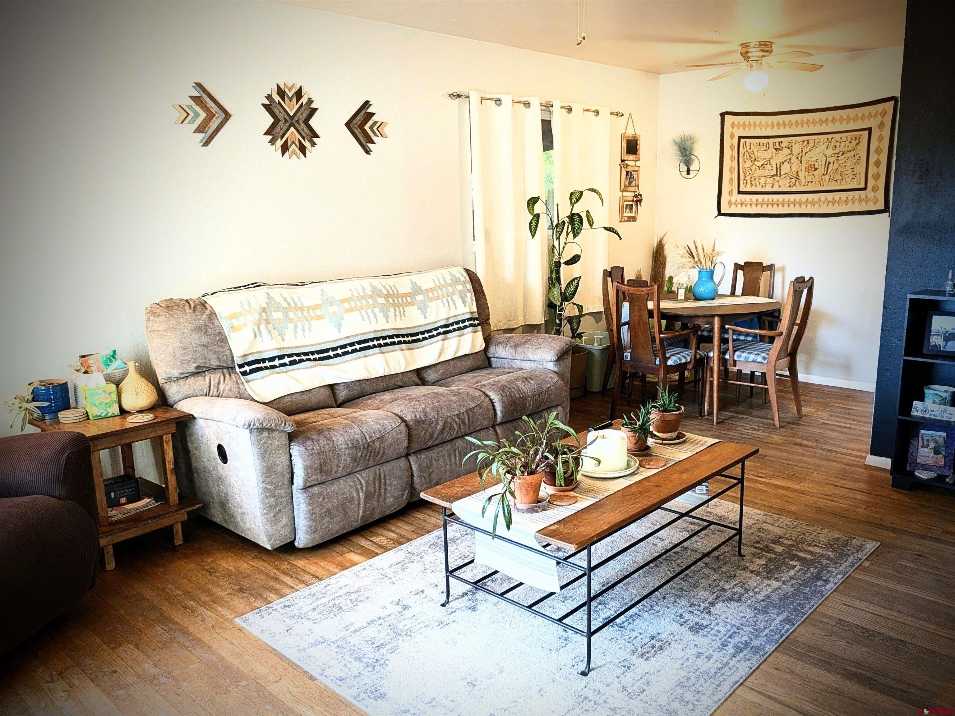 714 East 3rd Street Cortez, CO 81321 - Photo 5 of 14 a living room with furniture and wooden floor