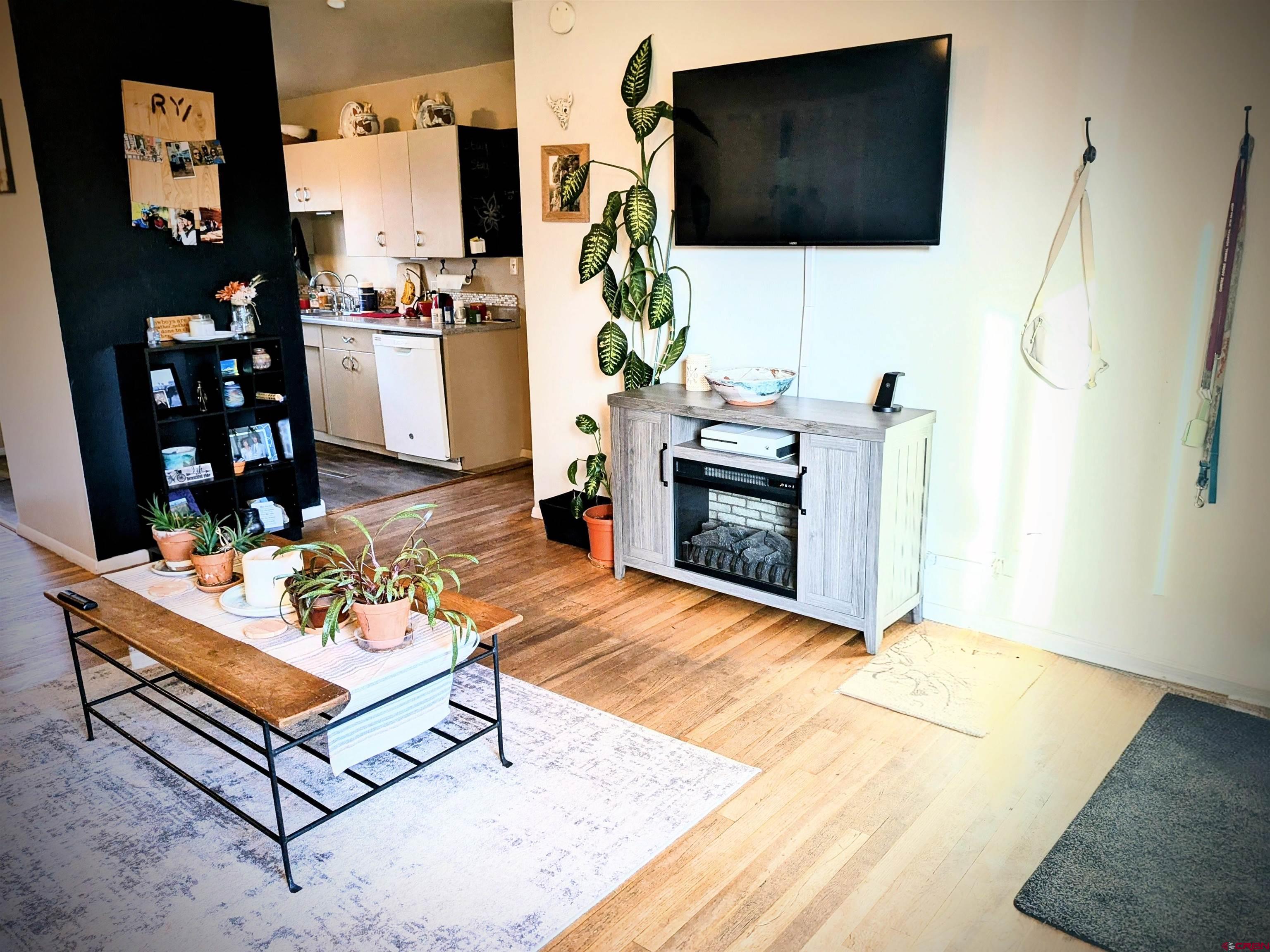 714 East 3rd Street Cortez, CO 81321 - Photo 6 of 14 a living room with furniture and a flat screen tv