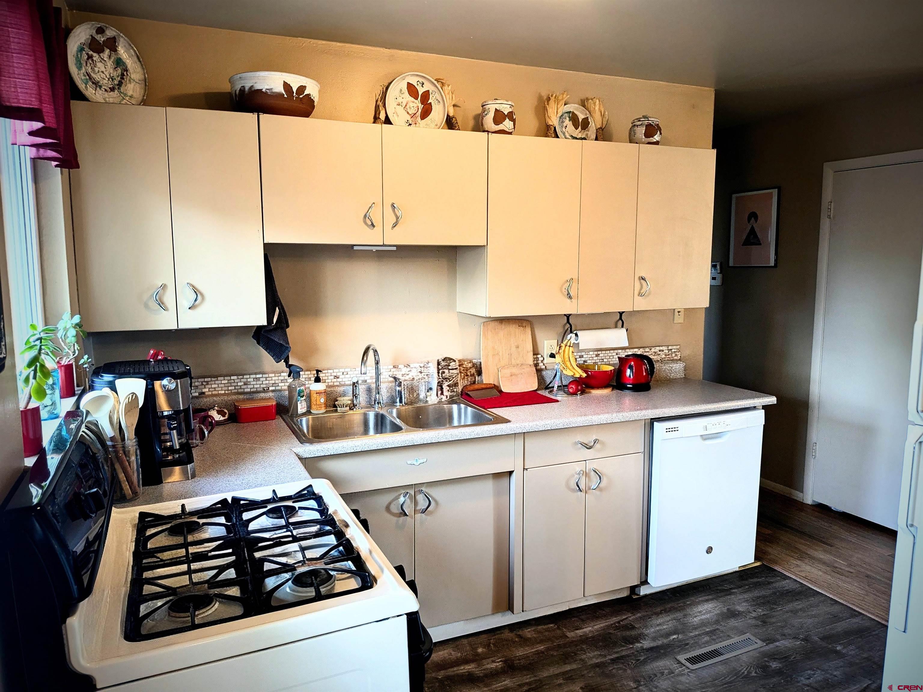 714 East 3rd Street Cortez, CO 81321 - Photo 9 of 14 a view of a kitchen with sink and cabinets