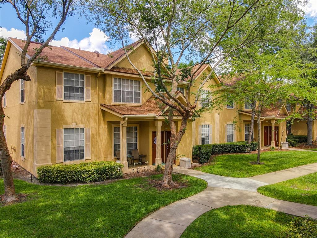 852 Grand Regency Pointe, Unit 203 Altamonte Springs, FL 32714 - Photo 1 of 1 a front view of a house with a yard
