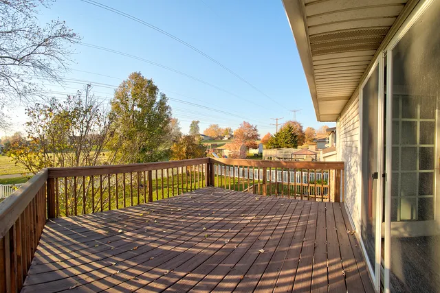a view of balcony with wooden floor
