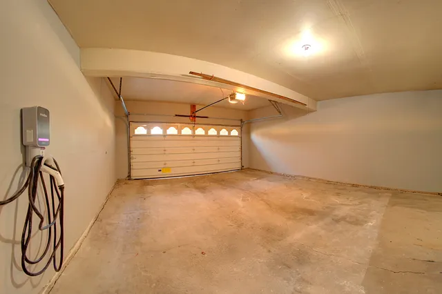a view of a room with wooden floor and windows