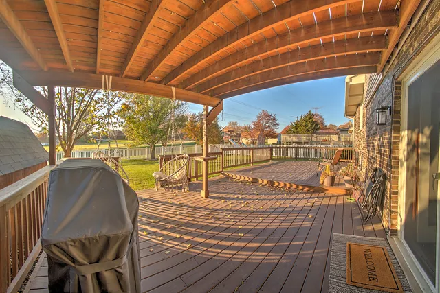 a view of a balcony with wooden floor