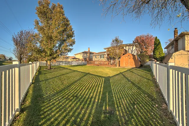 a view of a swimming pool with a yard