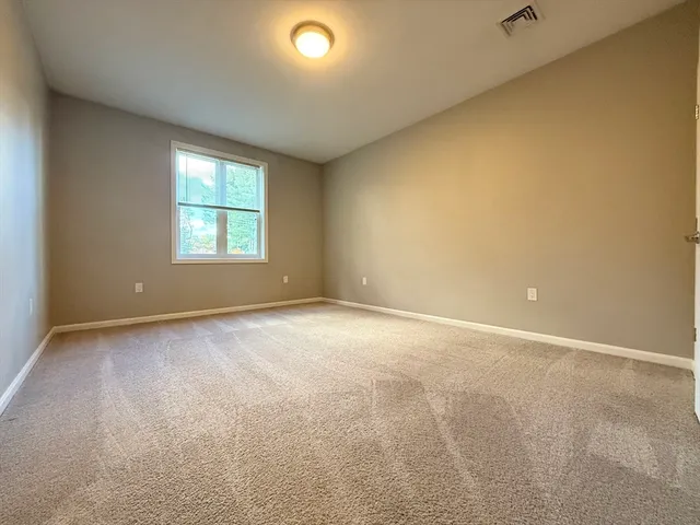 an empty room with a windows