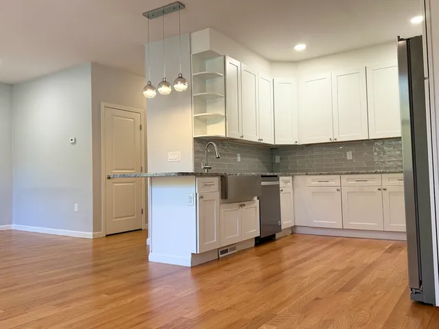 a view of a kitchen with electric appliances