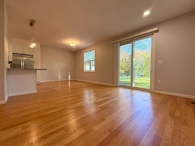 a view of a livingroom with wooden floor