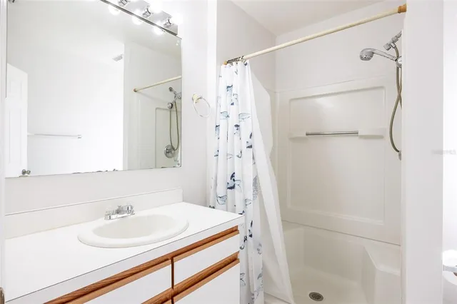 a bathroom with a sink and a shower
