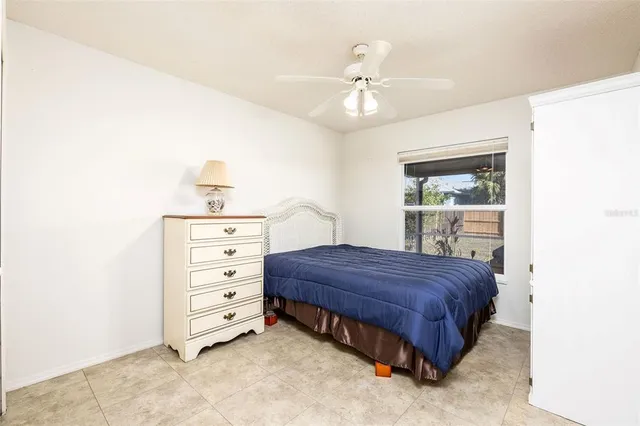 a bedroom with a bed and a cabinets