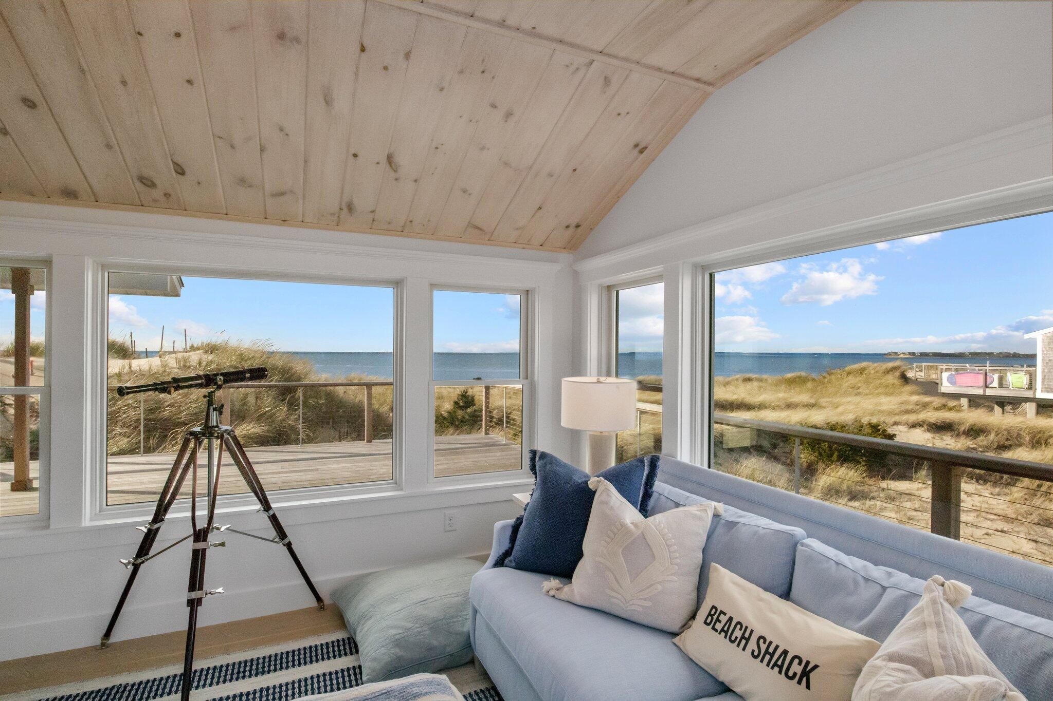 165 Harmes Way Eastham, MA 02642 - Photo 11 of 36 a living room with furniture and a large window