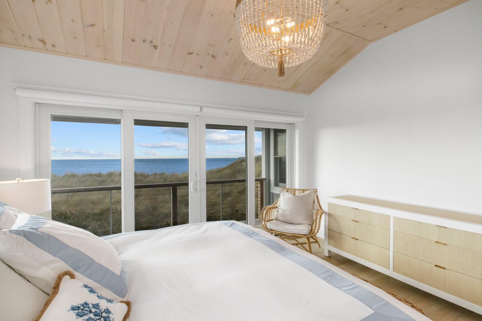 165 Harmes Way Eastham, MA 02642 - Photo 14 of 36 a bedroom with a bed and a window