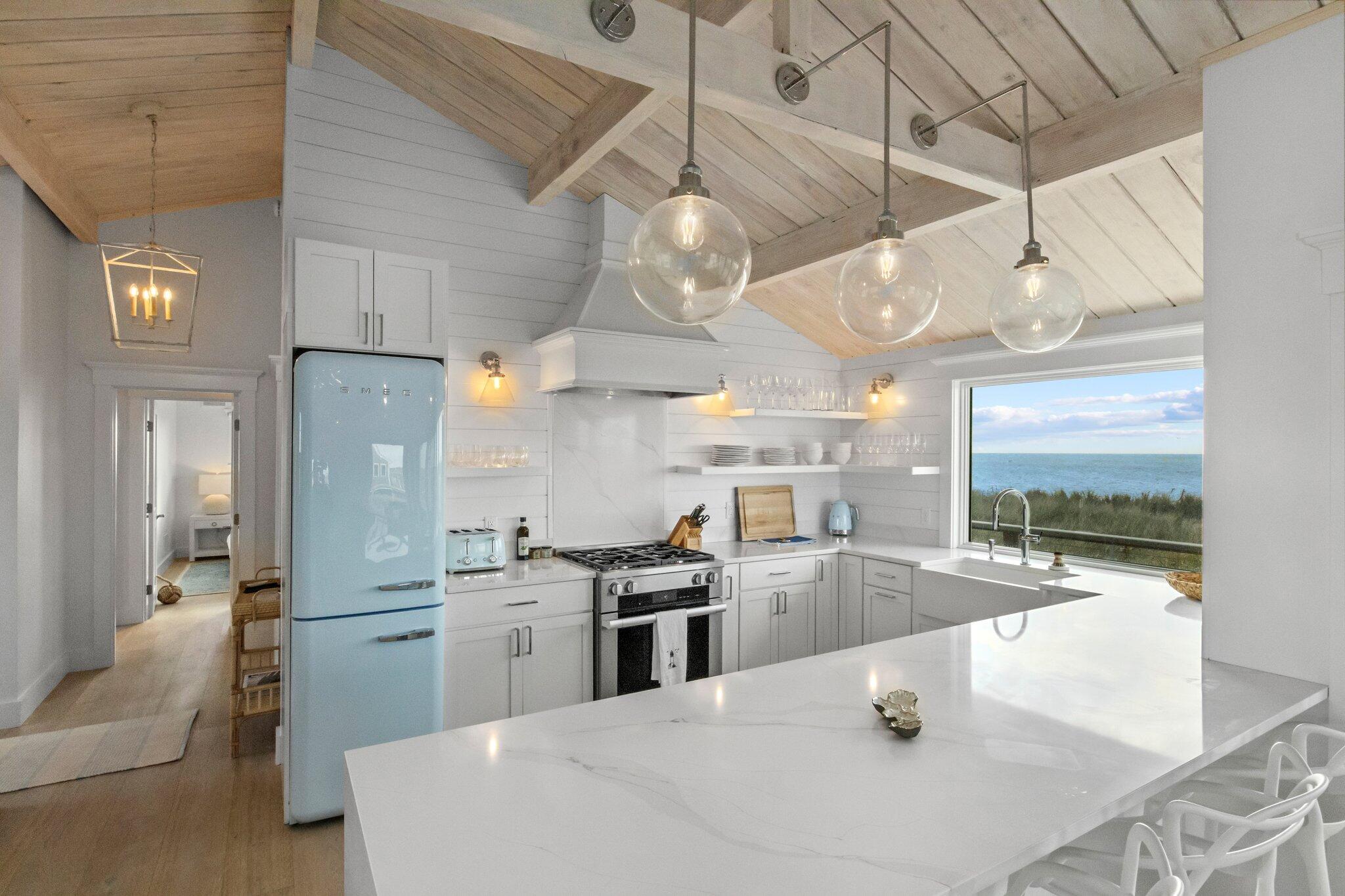 165 Harmes Way Eastham, MA 02642 - Photo 2 of 36 a kitchen with stainless steel appliances granite countertop a sink a stove and a refrigerator