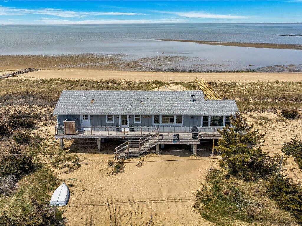 165 Harmes Way Eastham, MA 02642 - Photo 21 of 36 a view of a house with a ocean view