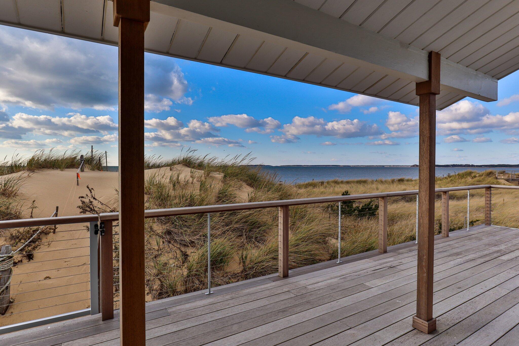 165 Harmes Way Eastham, MA 02642 - Photo 28 of 36 a view of a balcony next to a road