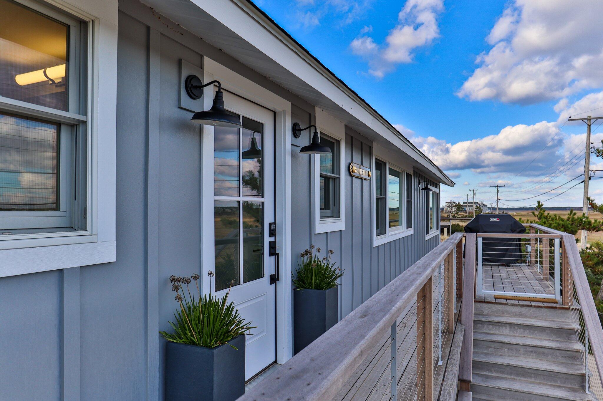 165 Harmes Way Eastham, MA 02642 - Photo 32 of 36 a view of a house with a potted plant