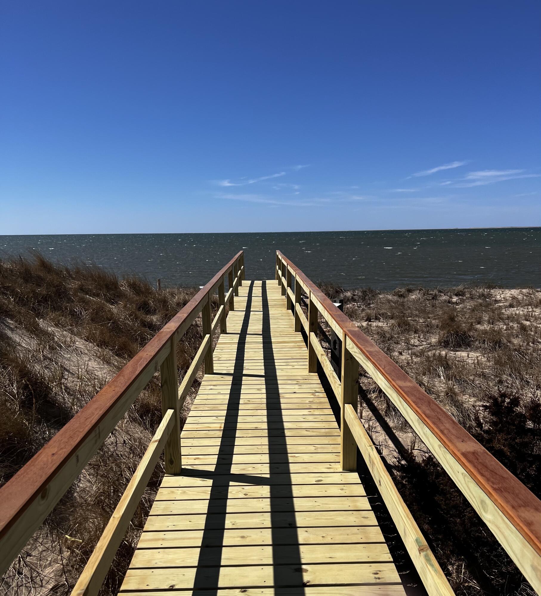 165 Harmes Way Eastham, MA 02642 - Photo 35 of 36 a view of balcony with wooden floor and fence