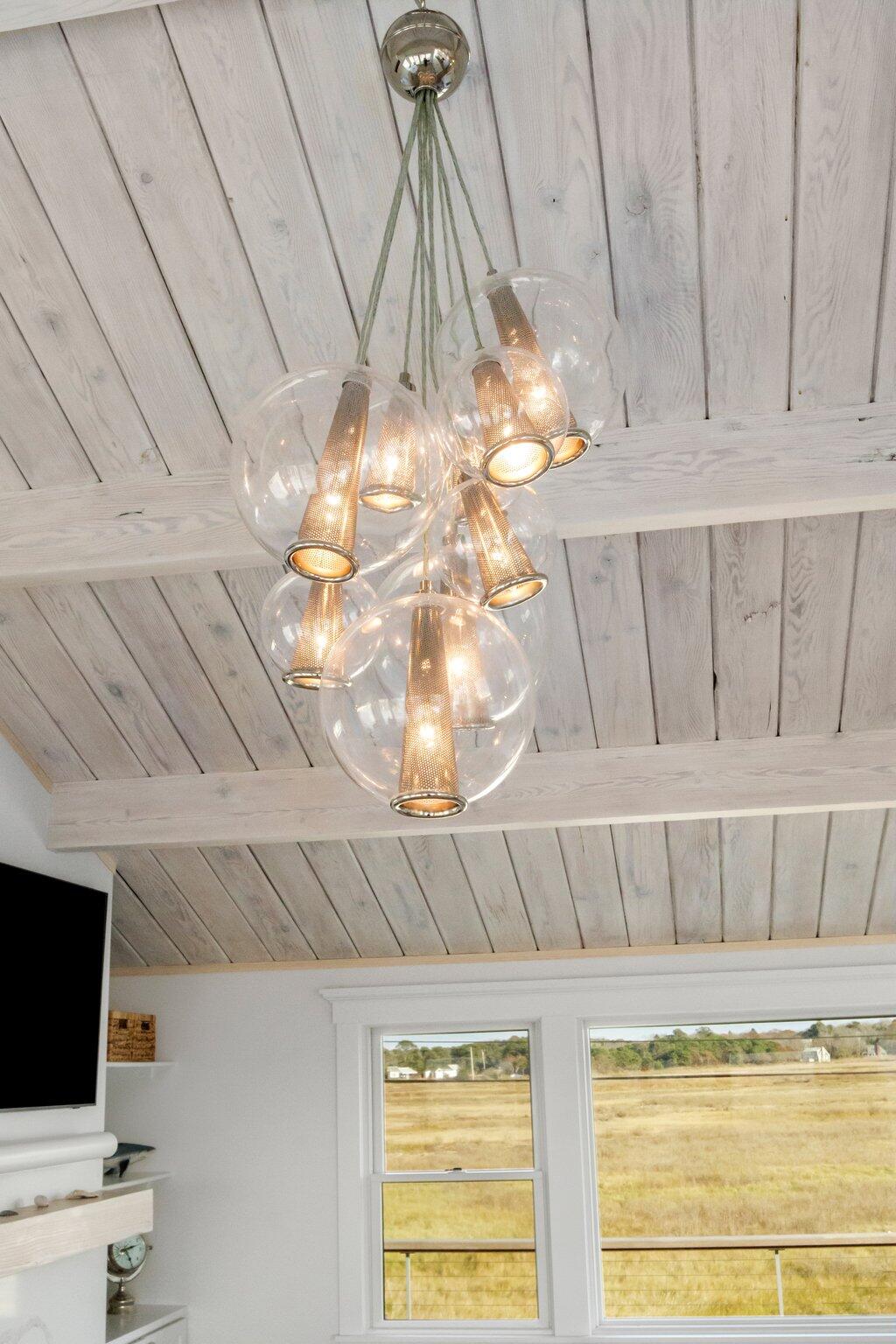 165 Harmes Way Eastham, MA 02642 - Photo 7 of 36 a view of a room with a flat screen tv