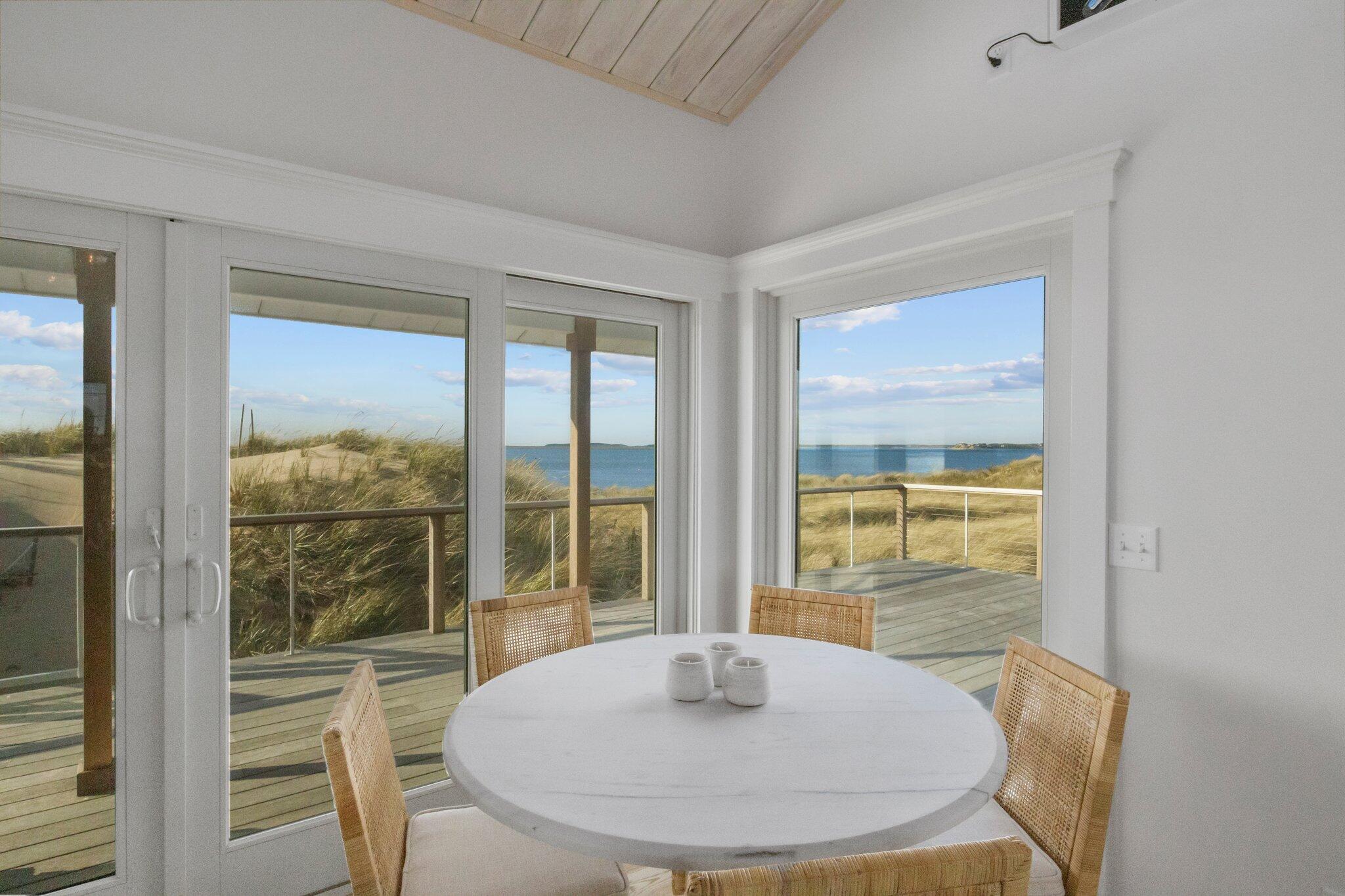 165 Harmes Way Eastham, MA 02642 - Photo 10 of 36 a view of a dining room with a table and chairs