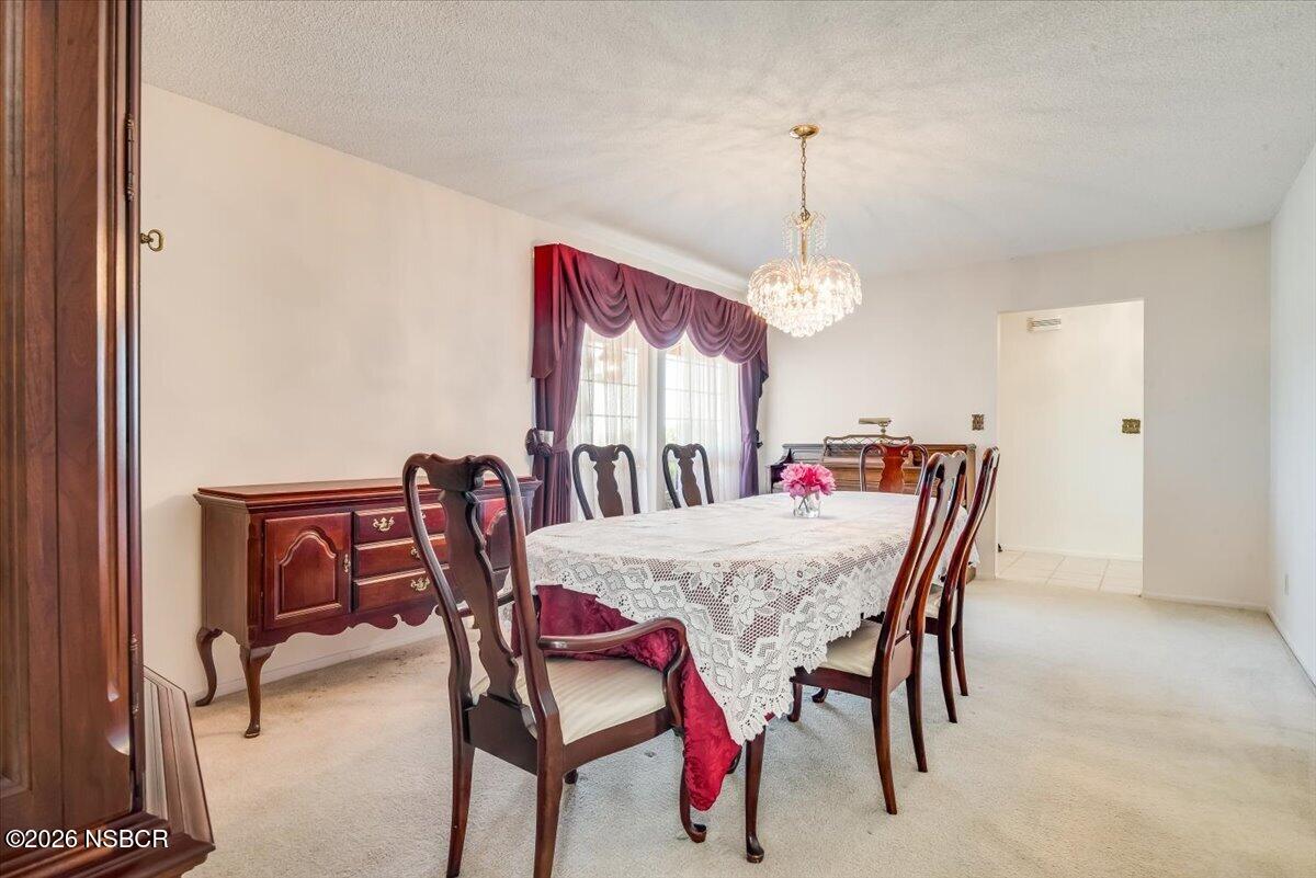 416 South Hawthorne Street Lompoc, CA 93436 - Photo 14 of 29 a view of a dining room with furniture and window
