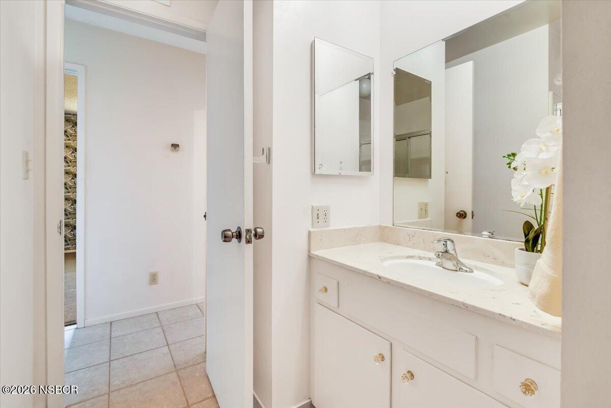 416 South Hawthorne Street Lompoc, CA 93436 - Photo 18 of 29 a bathroom with a sink and a mirror