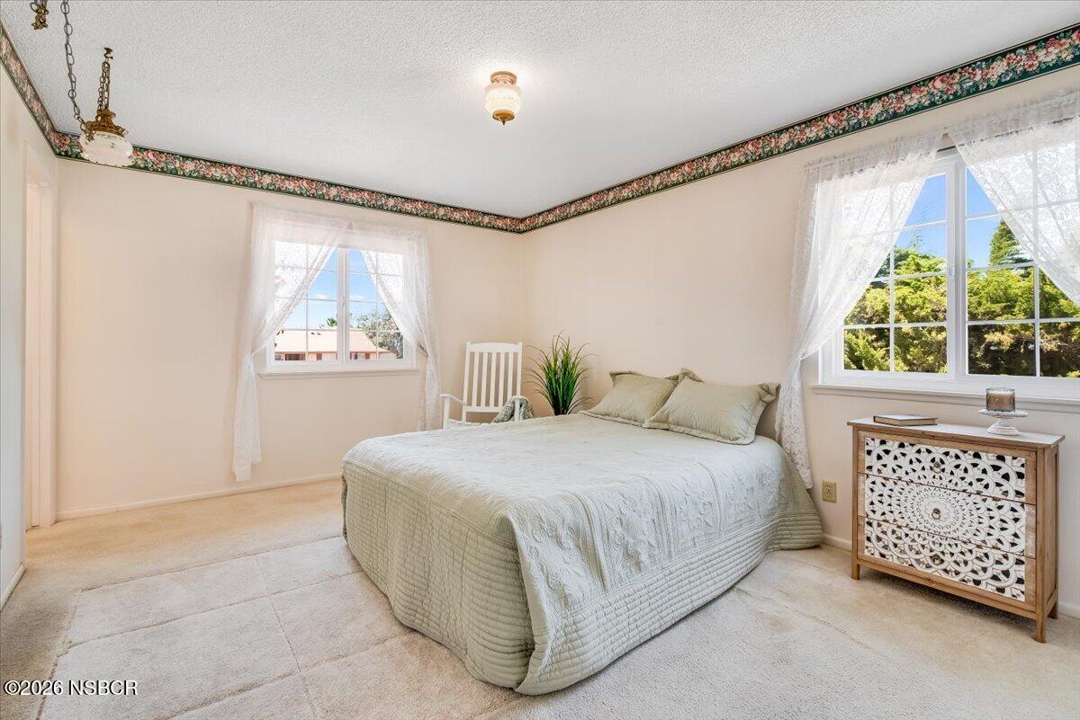 416 South Hawthorne Street Lompoc, CA 93436 - Photo 20 of 29 a bedroom with a bed dresser and window
