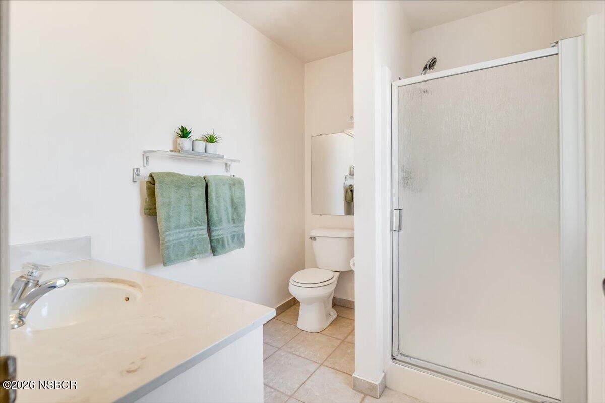 416 South Hawthorne Street Lompoc, CA 93436 - Photo 22 of 29 a bathroom with a sink a toilet and shower